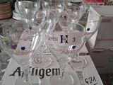 several empty wine glasses sitting on top of a box on a table