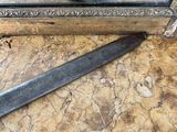 a knife that is laying on a table