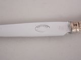 a knife that is sitting on a table