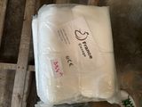a bag of white toilet paper sitting on a pallet