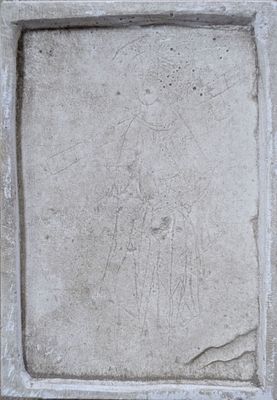 a stone plaque with a drawing of a woman on it