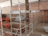 many scaffoldings in a building that is being built