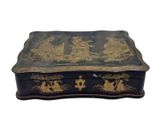 an image of a black box with gold decorations on it