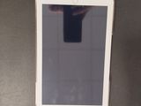 a white tablet computer sitting on top of a table