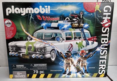 a box of playmobil ghostbusters with a ghostbuster