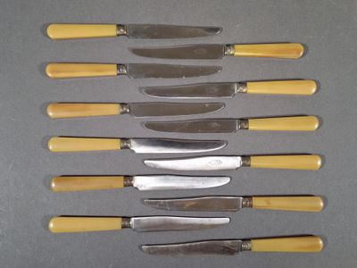 five knives that are lined up on a table