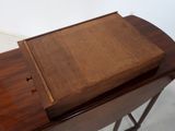 a small wooden box sitting on top of a table