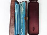 a brown case with a blue lining inside of it
