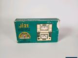 a green box with a clock on it on a white surface