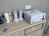 a white machine sitting on top of a wooden cabinet