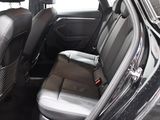 a black car with a black leather seat in the back of it