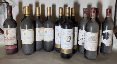 several bottles of wine are lined up in a row on a shelf