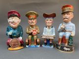 four figurines of different people sitting on a bench