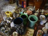 a table with many different types of vases on it
