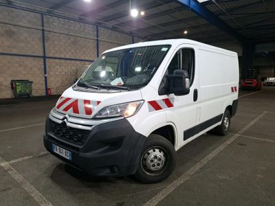 a white van that is parked in a parking lot
