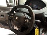 a steering wheel and dashboard of a car in a showroom