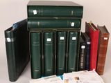 several books are stacked on top of each other on a table