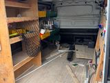 the inside of a van with shelves and shelves in the back