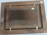 a picture of an old wooden picture frame on the wall