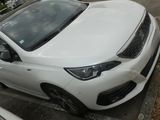 a white car parked on the side of the street