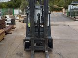 a forklift that is parked in a parking lot