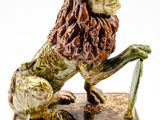 statue d'un lion sur un socle en bois, avec un fond blanc