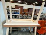 a table with a chair on top of it in a room