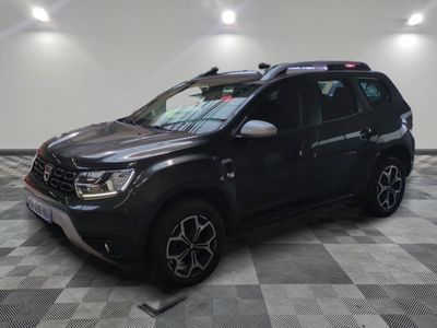 the black dacia is parked in a room with a checkered floor