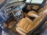 a car that is sitting in the garage with the door open