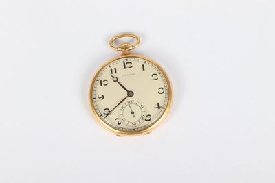 an antique pocket watch on a white surface with a white background