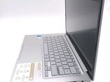 a silver laptop computer sitting on top of a white table