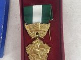 a box with a medal and other items on the table
