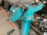 a machine that is sitting on a table in a garage