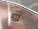 a metal object with a hole in the middle of it