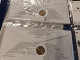 two envelopes that are sitting on top of each other