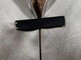 a close up of a person wearing a jacket and tie