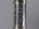 an antique silver plated cigarette lighter with the name of a man on it