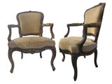 a pair of antique chairs with upholstered arms and arms