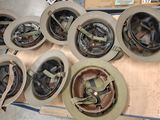 several helmets and helmets are on a cart in a warehouse