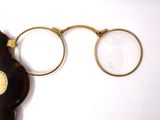a pair of glasses and a pair of glasses on a table