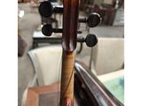 an image of a close up of a violin on a table