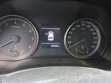a close up of a car dashboard with a speedometer and gauges