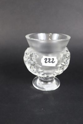 a close up of a glass cup on a black surface