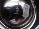 a close up of a metal object with a label on it
