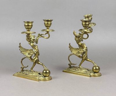 pair of antique brass candlesticks with cherenshes and angels