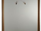 a picture of a picture of a mirror hanging on a wall
