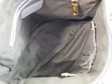 a purse that is open and has a zipper on the inside of it