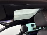 the interior of a car with a sunroof and a view of the back seats