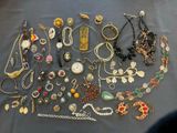 many different types of jewelry on the table
