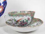 a tea cup and saucer sitting on a saucer